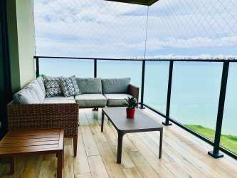 Modern bright kitchen with island and appliances in oceanfront condo Solaria Punta Caelo San Carlos Panama