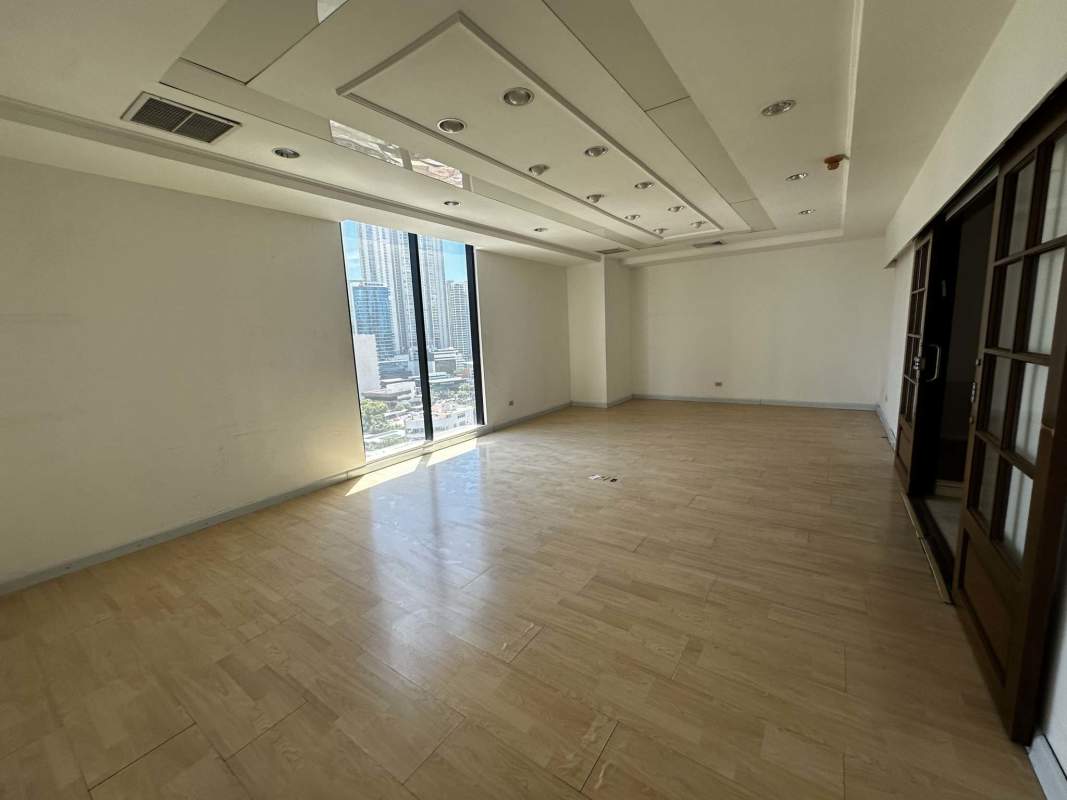 Open modern office with floor-to-ceiling windows and skyline at Ocean Business Plaza