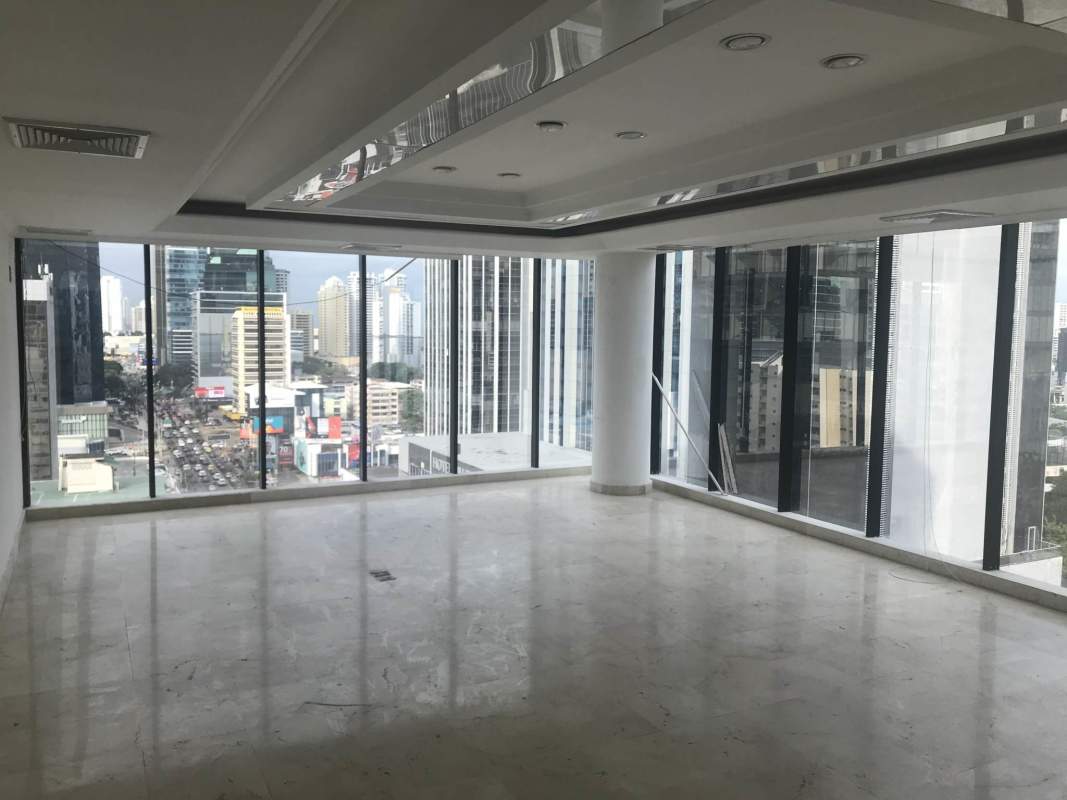 Spacious corporate office floor with floor-to-ceiling windows at Ocean Business Plaza
