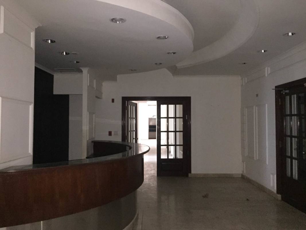 Reception area with curved desk and glass doors Ocean Business Plaza Panama City