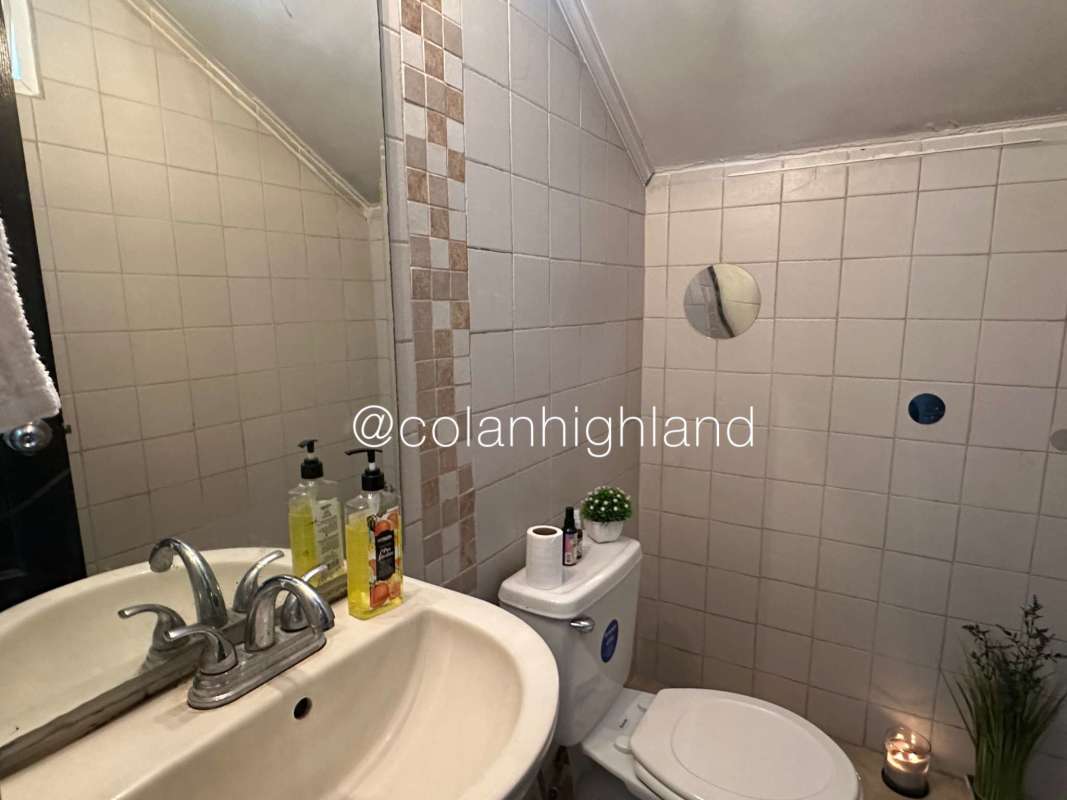 Bedroom with closet, large windows with blue curtains and tile flooring in PH Everest Brisas del Golf Panama