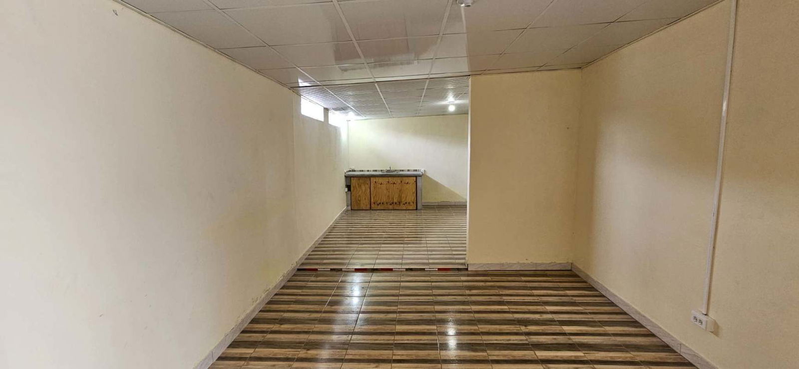 Small bedroom with kitchenette view, potential rental unit in Praderas San Antonio Panama