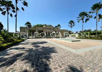 Modern open-plan living and dining area with balcony access at Perla Mar Casamar Panama