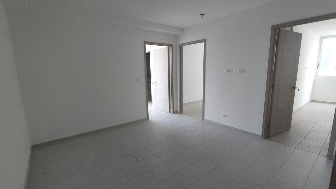 Spacious modern walk-in closet with built-in shelving and drawers The Towers Panama