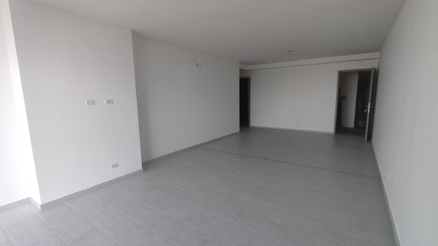 Modern kitchen space at The Towers with gray cabinets, tile floor and double sink, San Francisco Panama