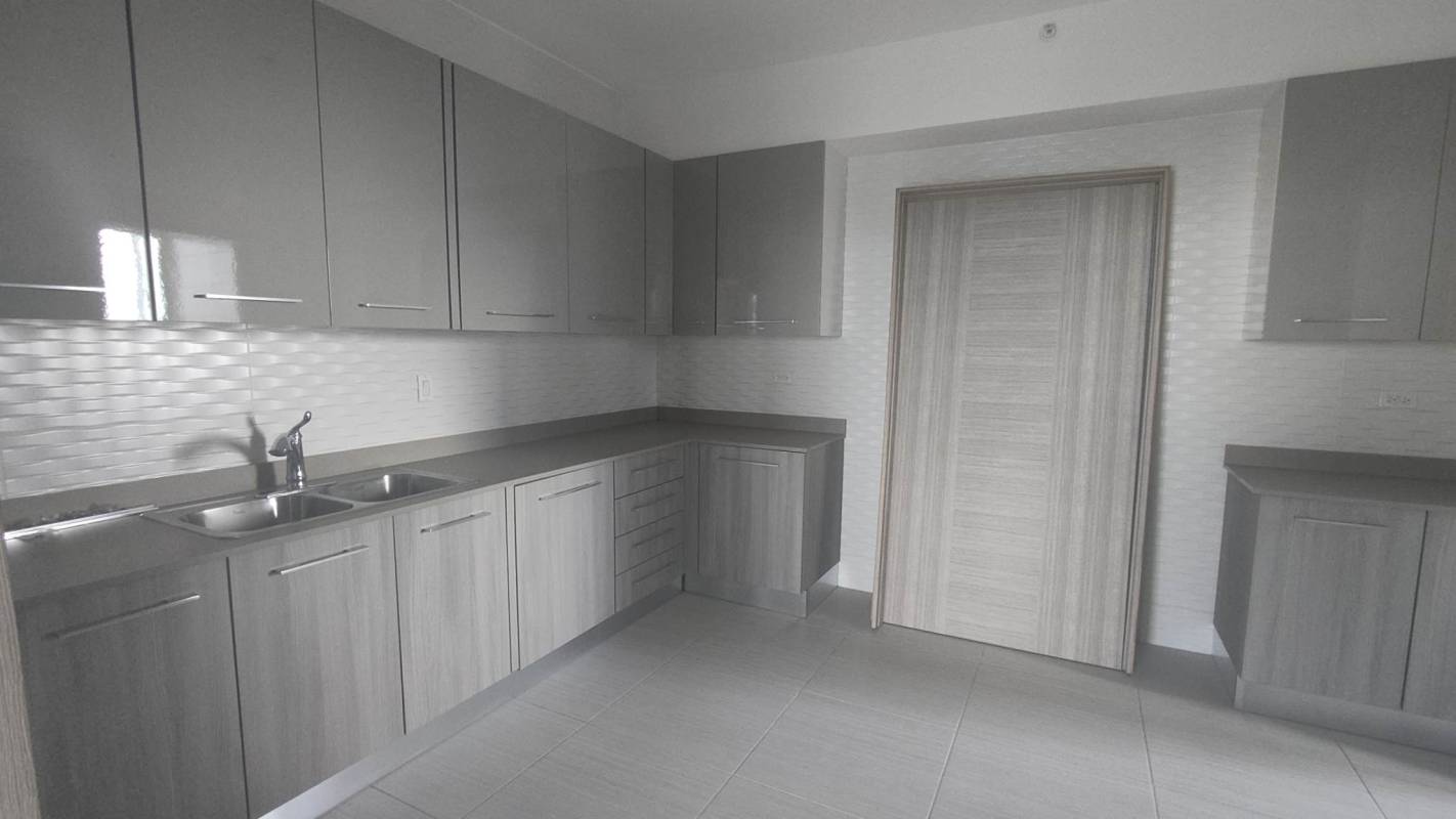 Open living room with floor-to-ceiling windows panoramic city view The Towers Panama