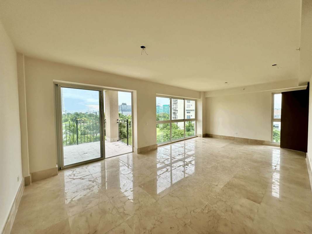 Luxury resort style swimming pool surrounded by palm trees and gardens in The Reserve Panama