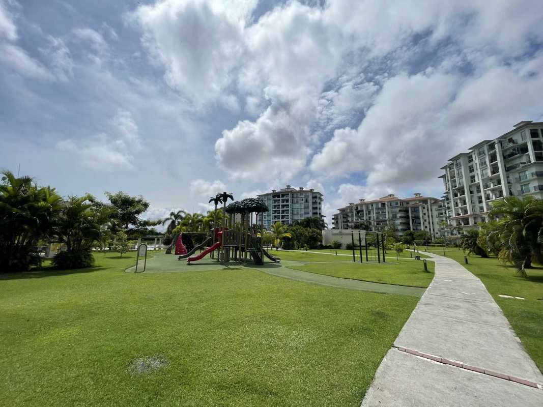 Large outdoor pool and The Reserve residential towers in Santa María Panama