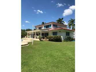 Spacious modern kitchen with granite island, premium appliances, and open layout in golf villa Coronado Panama