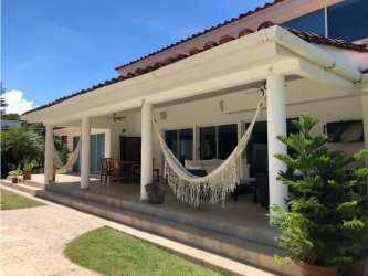 Upscale master bedroom with Jacuzzi spa tub, marble finishes, hardwood floors in Coronado Club de Golf villa Panama