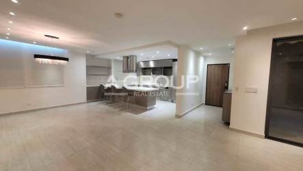 Bright open living and dining area with large windows in luxury Panama Pacifico house