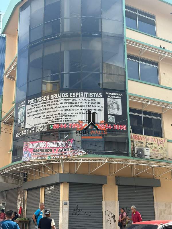 3-level commercial building exterior with glass facade corner location Calidonia Panama