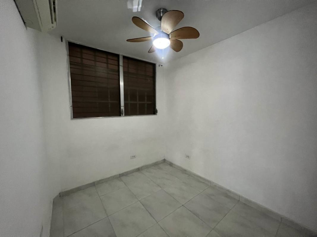 Functional kitchen with white cabinetry and granite countertops in Llano Bonito Panama City