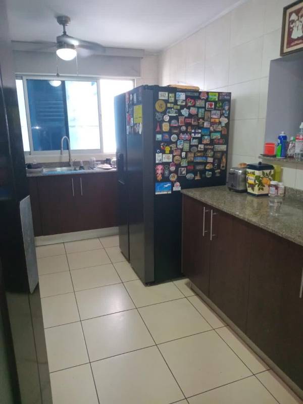 Modern kitchen with granite counters, refrigerator, appliances PH Constellation Tower Dos Mares Panama
