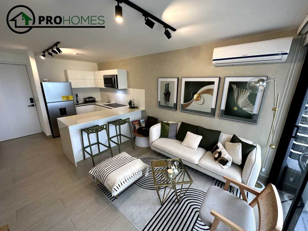 Furnished bedroom with AC, closet, and city skyline view at PH Living73 San Francisco Panama