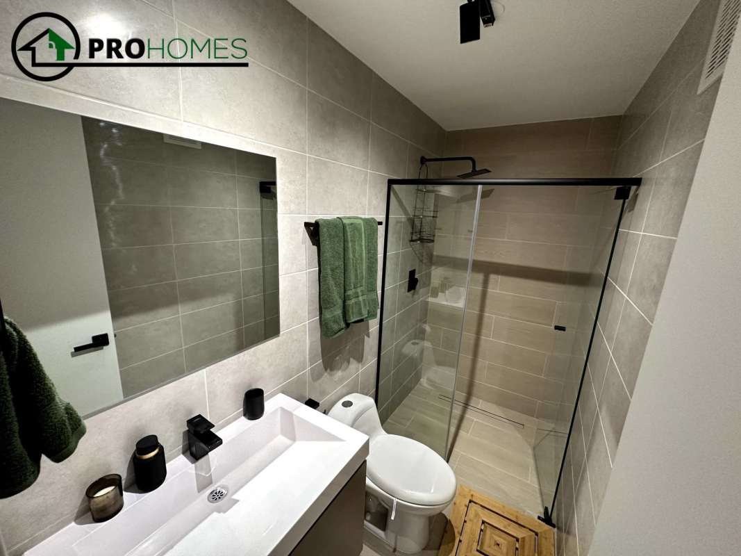 Spacious gym with exercise machines and city views PH Living73 San Francisco Panama