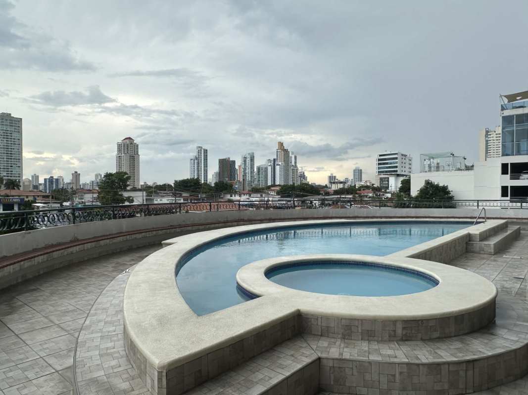 Bedroom featuring two beds, AC, and wood floors in PH Country Park Panama City