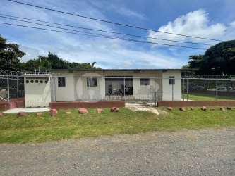 Bedroom interior with barred windows and tiled floor at Bethel Apartments Santiago