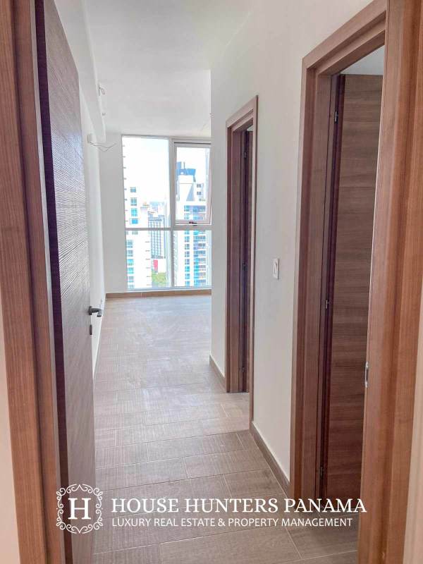 Gym with panoramic windows and cardio equipment at Dynasty Residence in Panama City