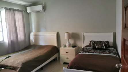 Furnished bedroom with air conditioning in The Hilltop Vista Alegre Panama