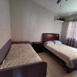 Bedroom with twin beds, AC and curtains The Hilltop Vista Alegre Panama