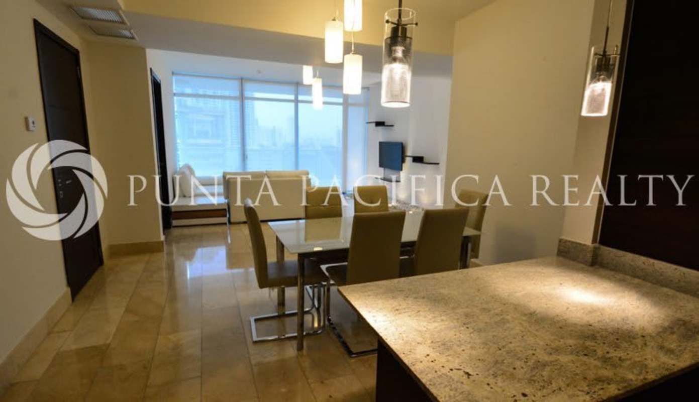 Bedroom with built-in closet, white walls, dark doors in Grand Tower Punta Pacifica Panama City