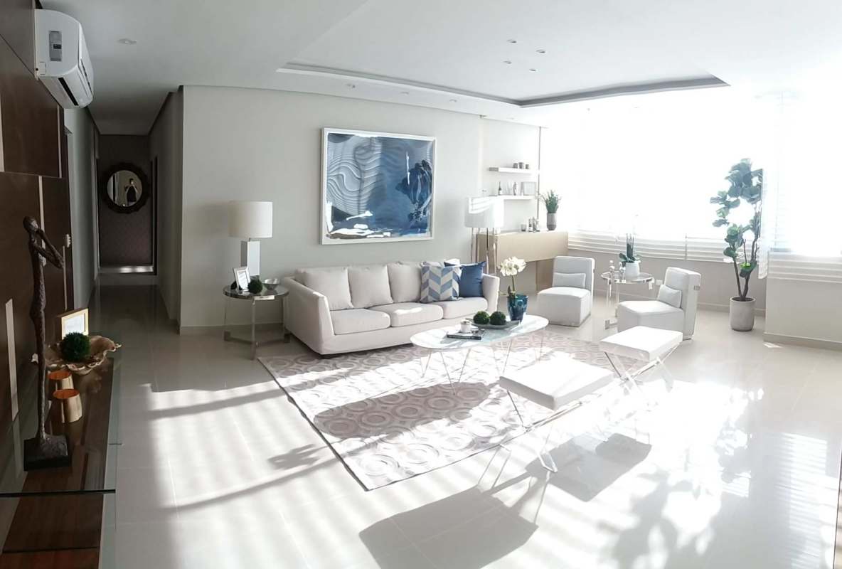 Luxury bedroom with upholstered headboard, modern lighting, and city views at PH Brisa Marina Costa del Este Panama