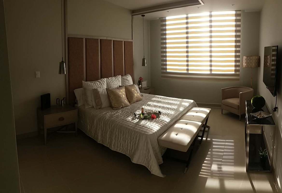 Rooftop lounge area with pergola, swimming pool, and skyline views at PH Brisa Marina Panama