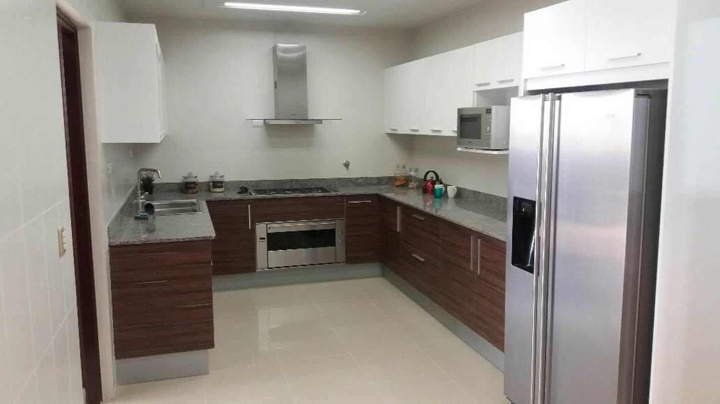 Modern apartment complex featuring swimming pool, children's area, and high-rise buildings in Costa del Este Panama