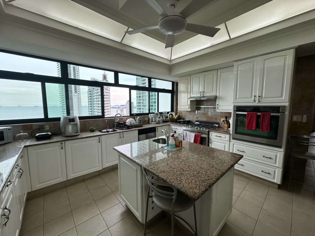 Modern kitchen with granite counters and ocean views penthouse in PH Panamar Panama City