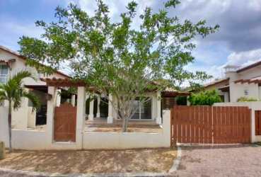 Mediterranean style single-family home with front courtyard and wooden gate in PH Fontanella del Mar San Carlos Panama