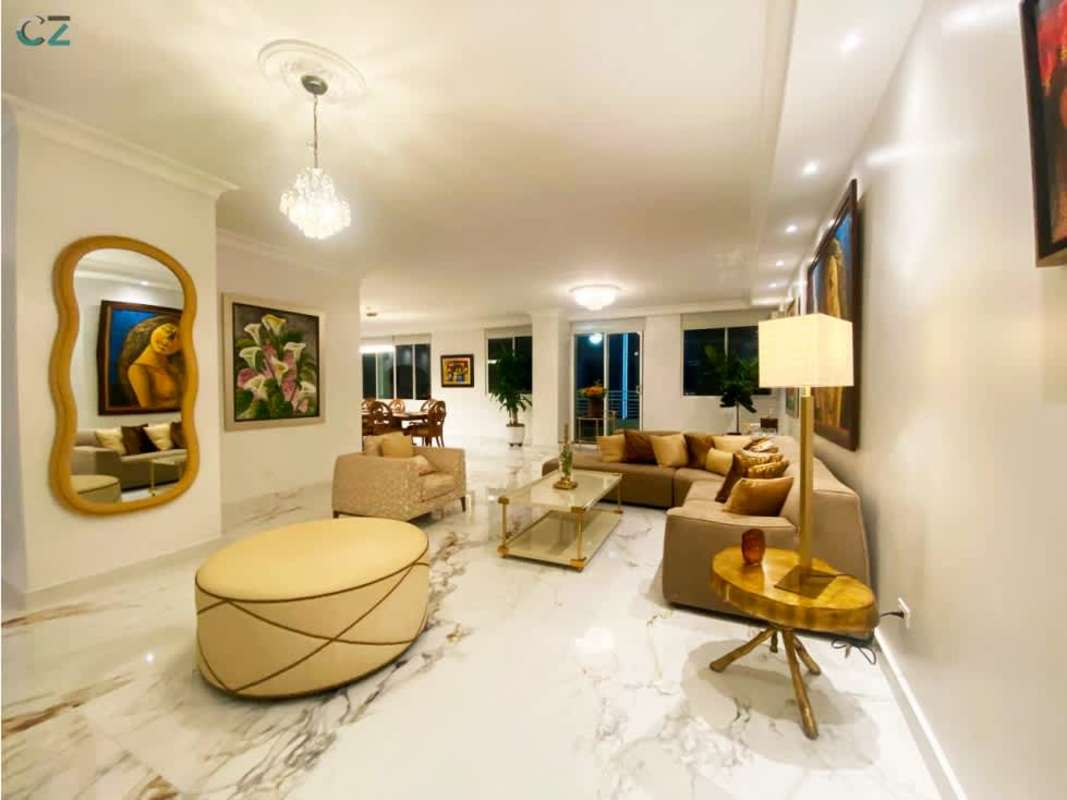 Modern kitchen with built-in appliances, wood cabinetry PH Sunrise Obarrio Panama