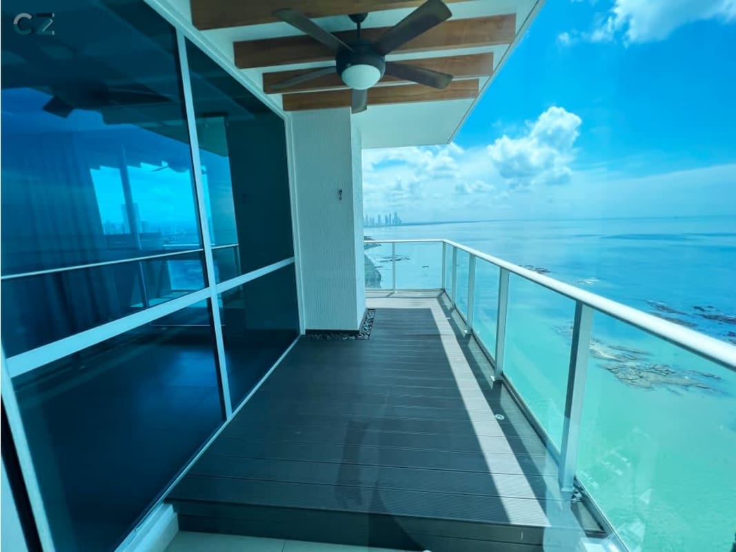 Oceanfront balcony with glass railing and panoramic views at PH Oceanaire Punta Pacifica Panama