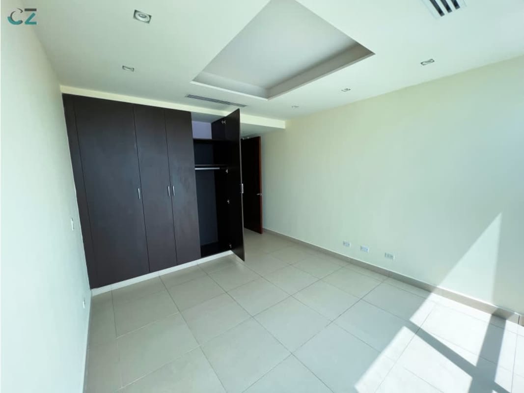 Large master bedroom with ocean view windows and ensuite bath at PH Oceanaire Punta Pacifica Panama