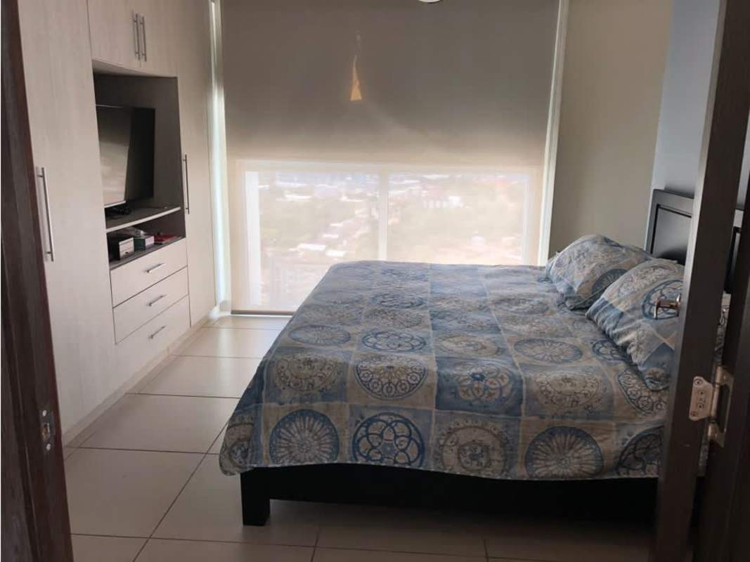 Bedroom with large window, roller blinds, built-in wardrobe and AC in PH Kings Park Condado del Rey Panama