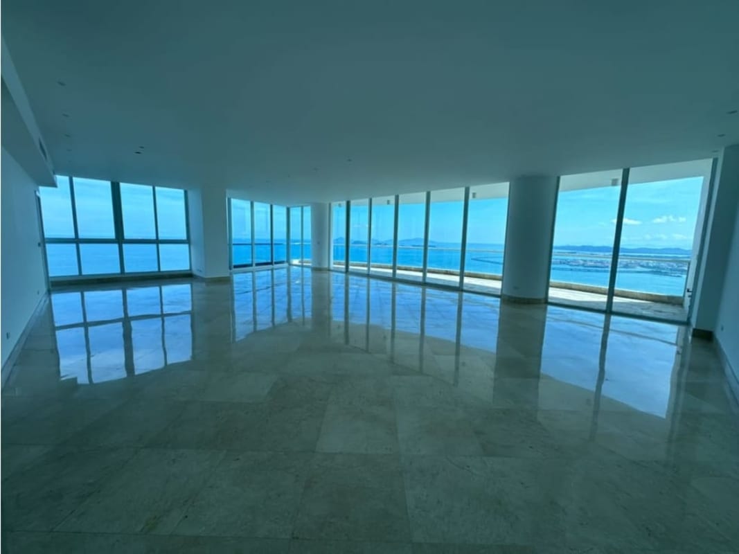 Large master bedroom with luxury marble floors, ocean view balcony in Pacific Point high-rise Panama City