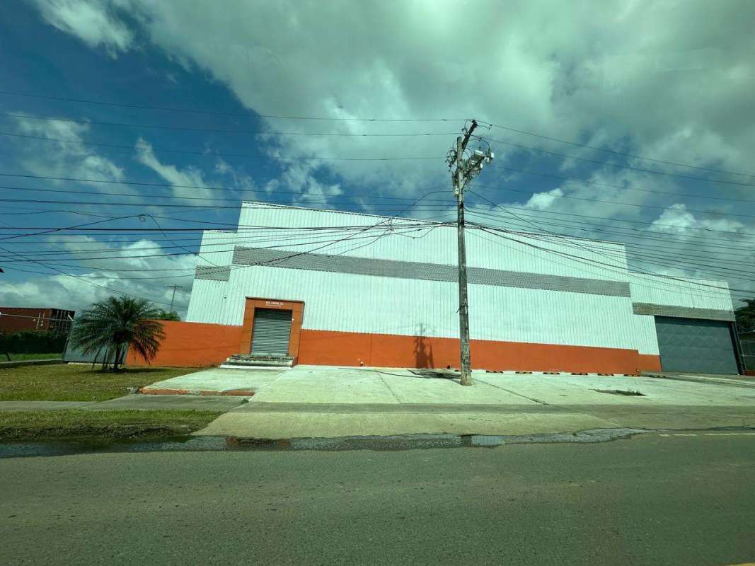 Warehouse interior with steel structure high ceiling concrete floor mezzanine office Cerro Azul Panama