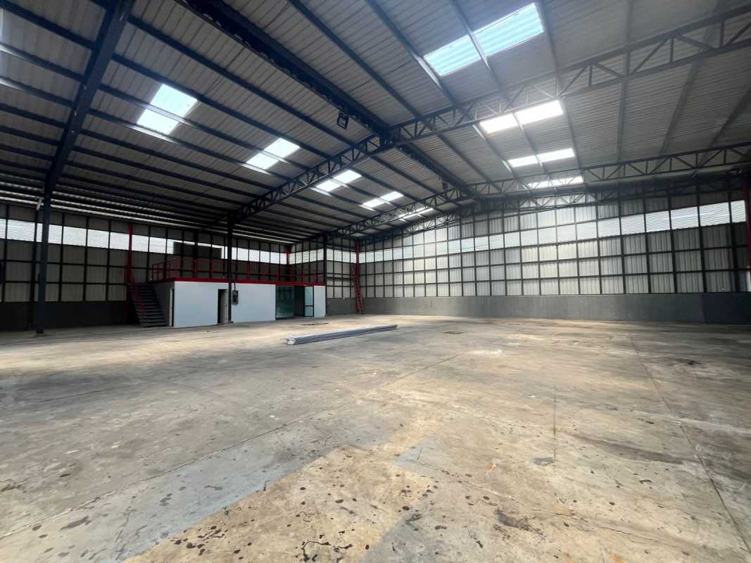 Industrial warehouse exterior with parking spaces entrance Cerro Azul Panama near airport