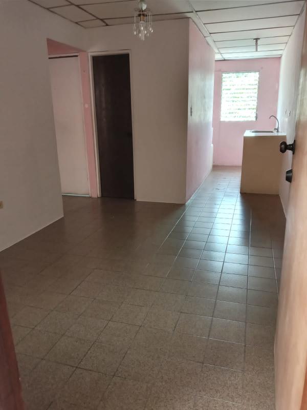 Hallway with ceramic tile floor leading to small kitchen PH Morya Panama