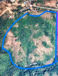 Countryside paved road bordering large undeveloped land plot La Laguna Chame Panama