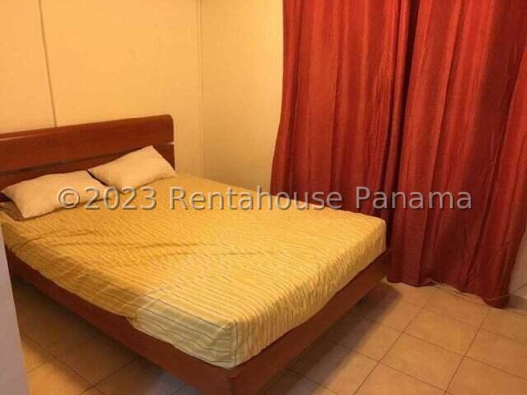 Bedroom featuring double bed, red curtains, tile flooring in PH Campo Limberg Panama City