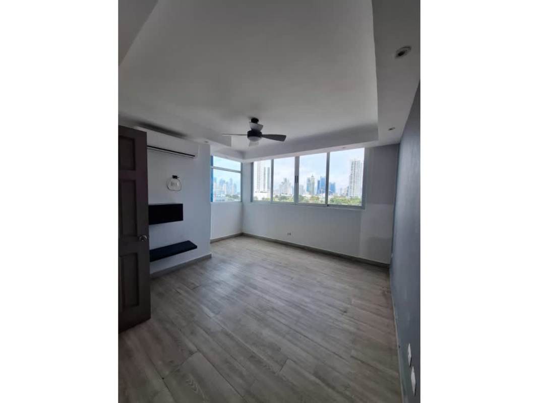 Bright bedroom with large closet, ceiling fan, large window to city skyline PH Harmony San Francisco Panama