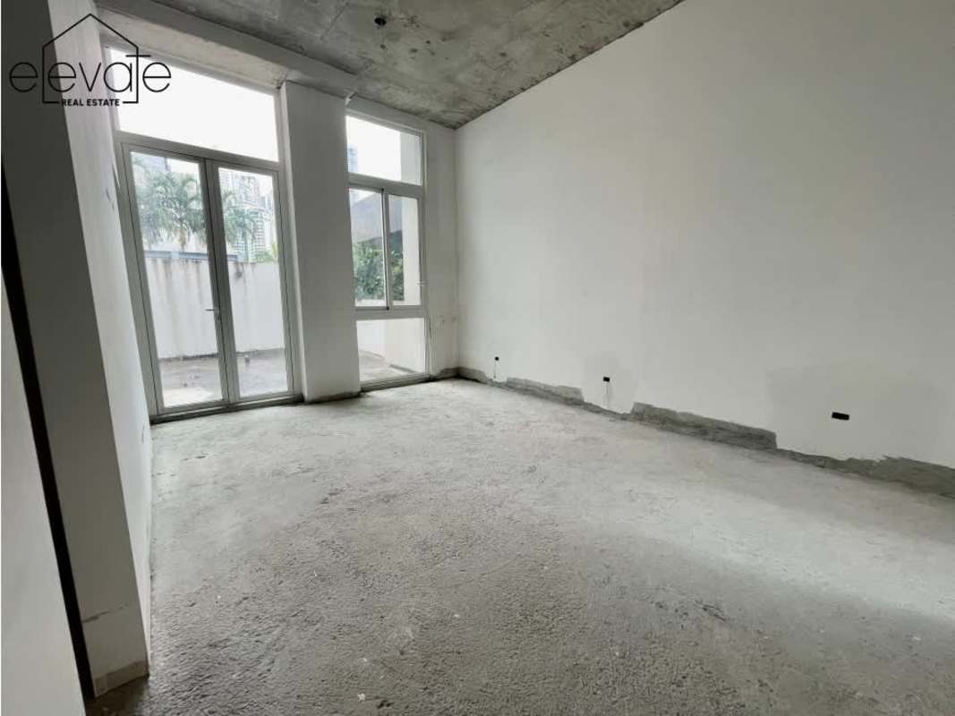 Unfinished penthouse shell with large windows overlooking marina at Ocean Reef Islands Panama