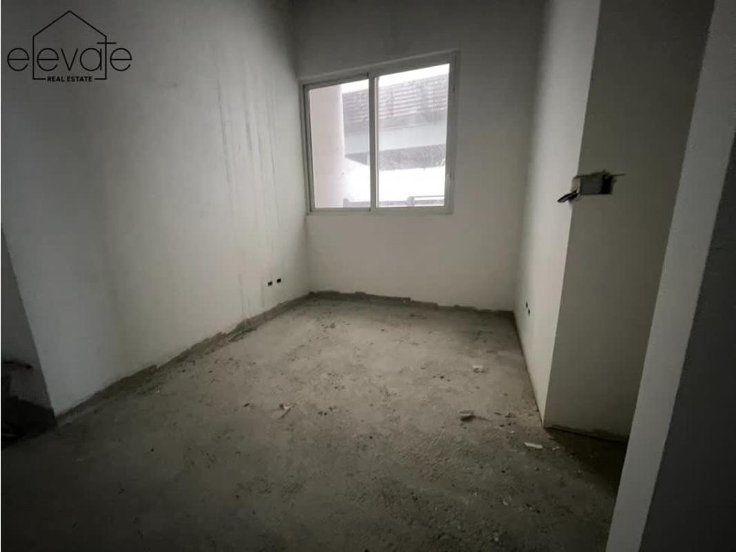 Spacious unfinished living room with floor-to-ceiling windows and marina views at Ocean Reef Islands Punta Pacífica Panama