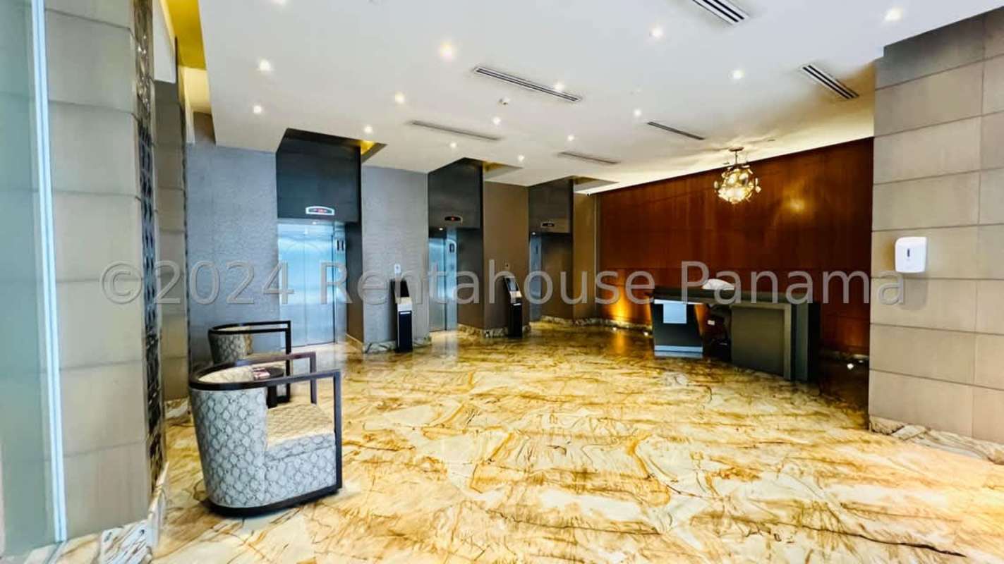 Modern corporate elevator lobby with granite walls in Twist Tower Panama