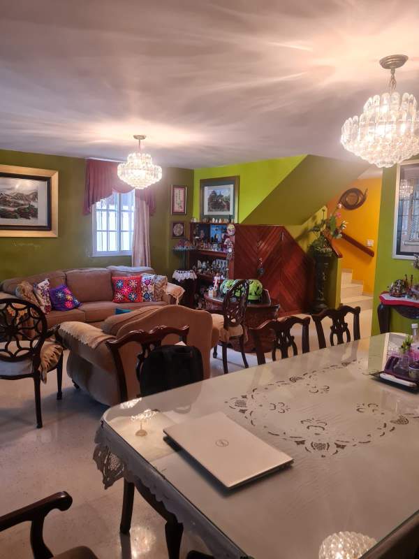 Bathroom with decorative sink, wooden vanity, and tile accents in Altos de Santa María Panama
