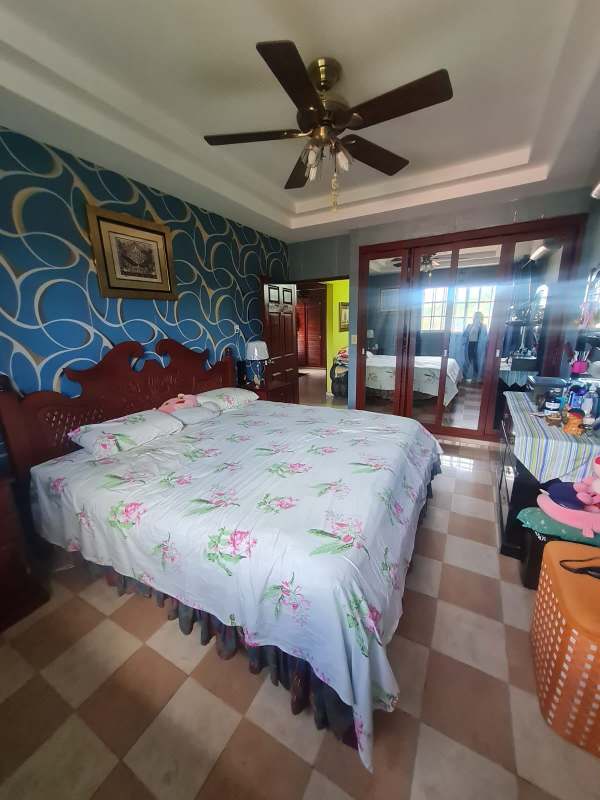 Outdoor paved patio with black water tanks and gazebo in Altos de Santa María Panama