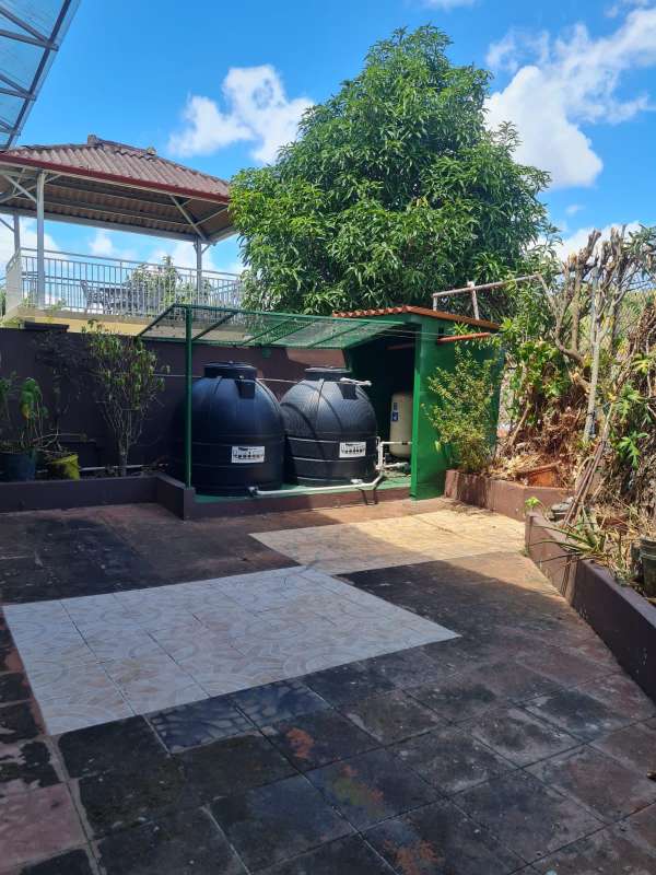 Foyer with wooden door, decor and carved bench Altos de Santa María Panama