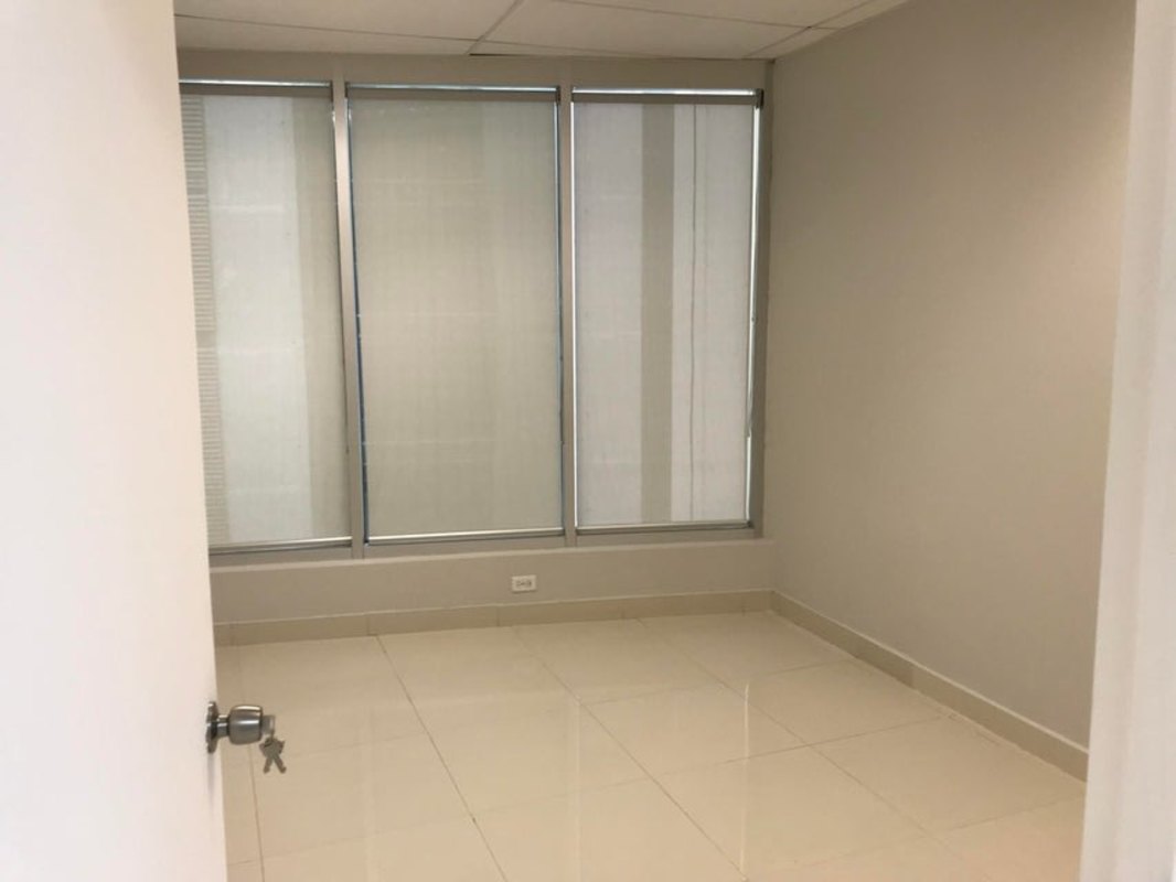 Small enclosed room with tile floor view through open door in PH Banesco Tower Panama