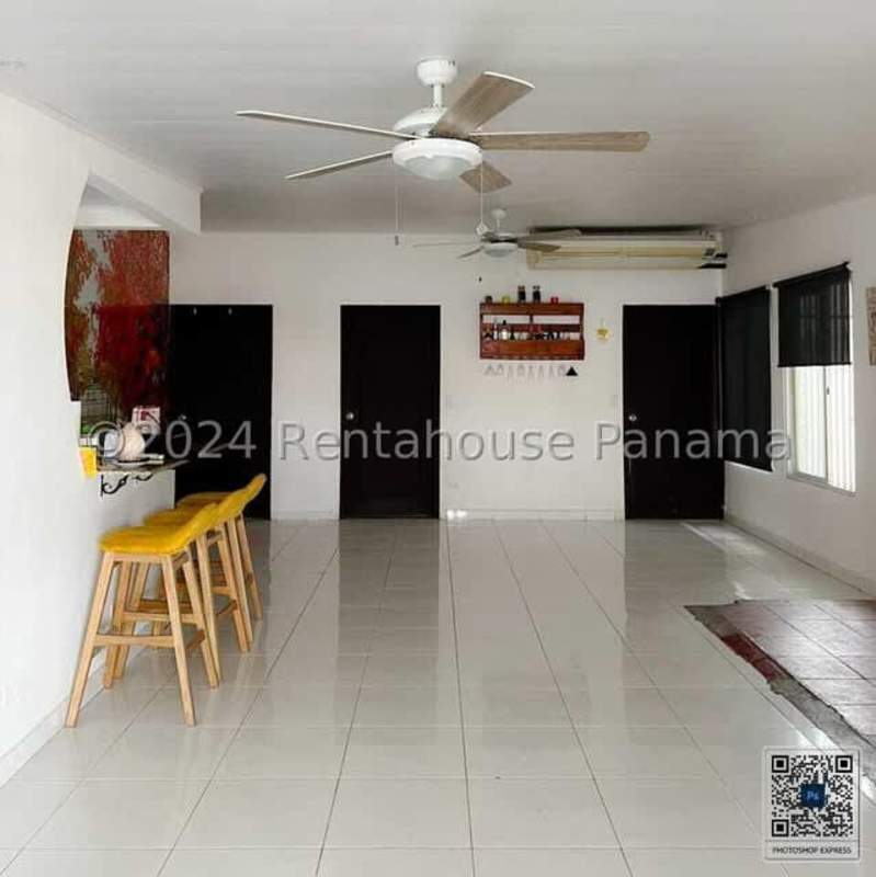Kitchen with granite countertops and wood cabinetry in house for sale Chanis Panama